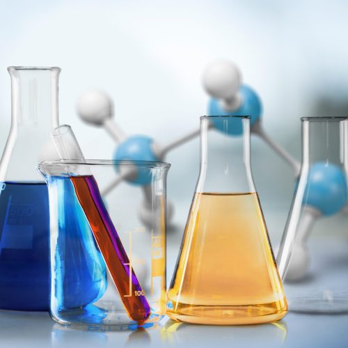 Glass,Test,Tubes,With,Liquid,Stand,On,A,Table,In