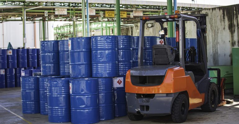 Oil barrels forklift truck move for on the transportation Oil barrels forklift truck move for on the transportation truck.